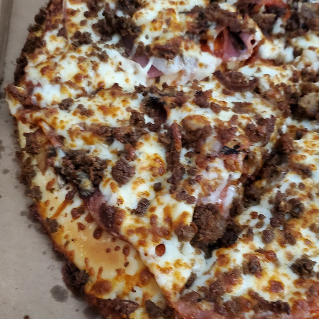 Pizza Pepperoni Salami Onions Green Pepper and Ground Beef with Extra Cheese