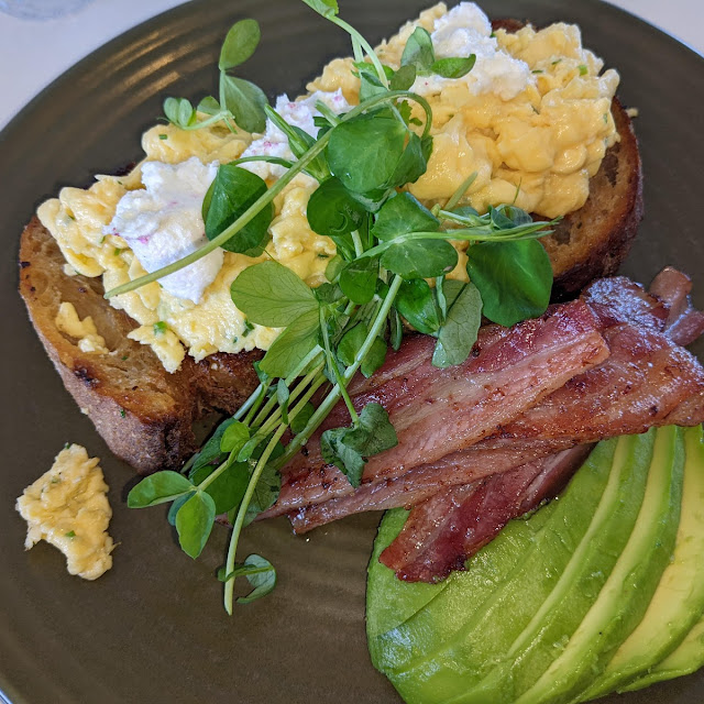Scrambled Eggs Goat Cheese Bacon and Avocado on Sourdough Toast