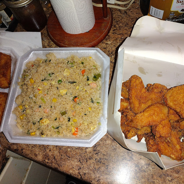 2 9 Piece Chicken Wings lg Shrimp Fried Rice and 4 Egg Rolls
