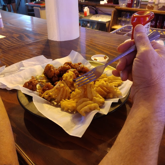 Sissy Nuggets in Bourbon Sauce with Waffle Fries