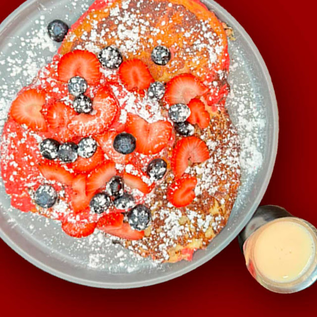 Concha French Toast with Eggs & Bacon Strawberries & Blueberries