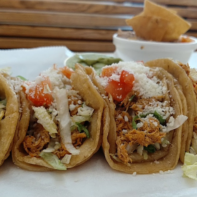 4 Chicken Tacos with Beans Rice and a Side of Guacamole