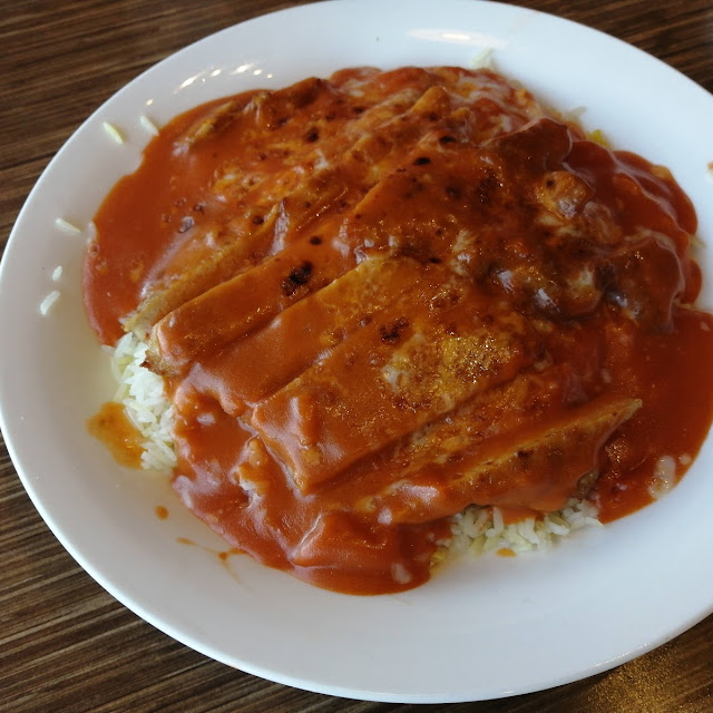 Baked Pork Chop on Rice with Tomato Sauce and Cheese