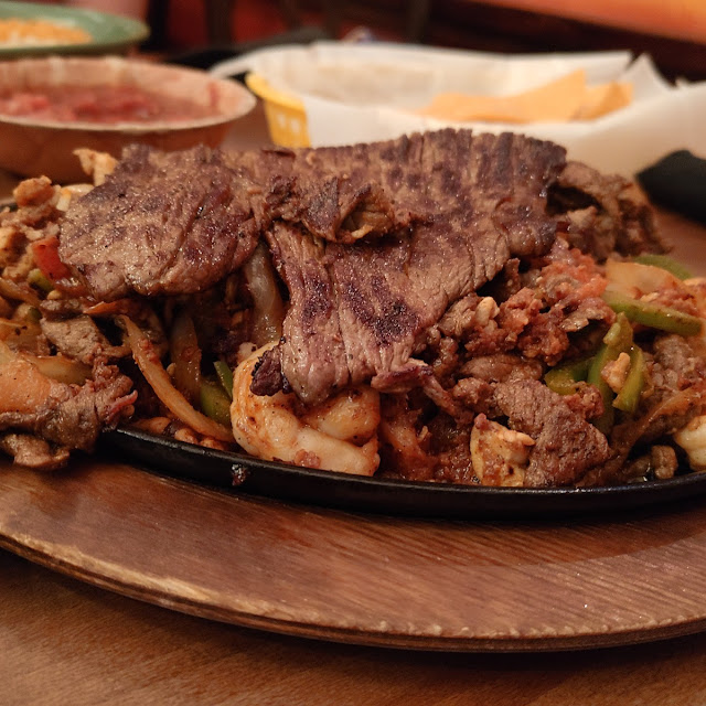 Beef Chorizo Shrimp Chicken & Skirt Steak Sizzling Fajita Platter