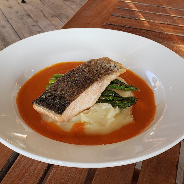 Crispy Skin Salmon over Butter Mashed Potatoes with Tomato Emulsion