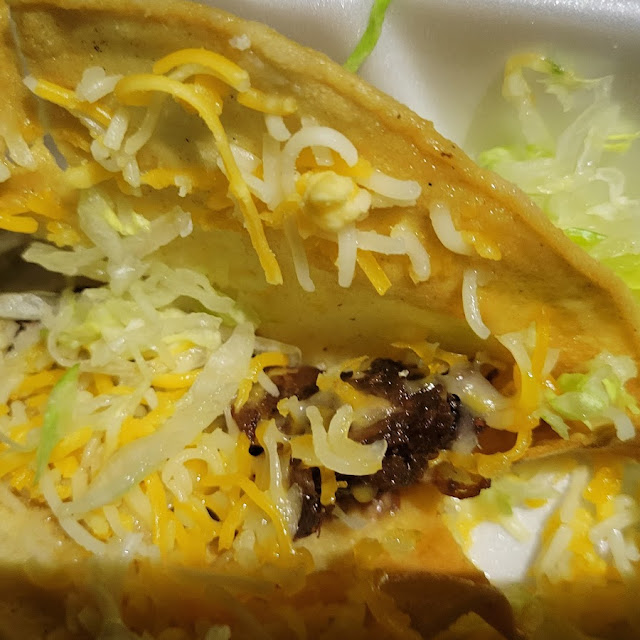 One Shredded Beef Taco and Chicken Enchilada