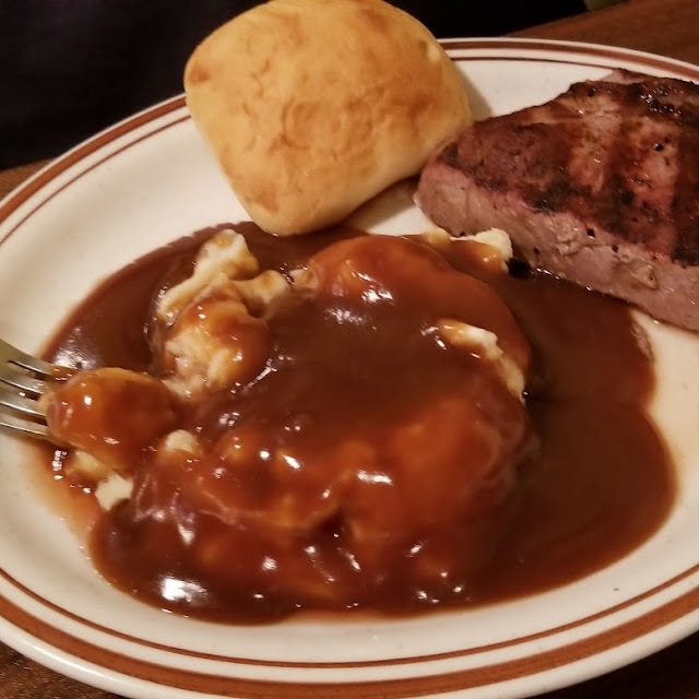 8 Oz Sirloin Steak with a Roll and Mashed Potatoes and Gravy