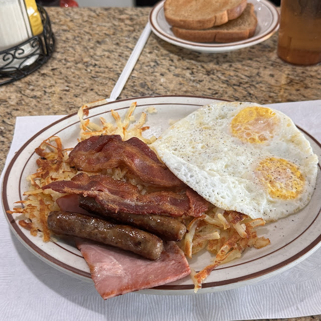 Pancakes or French Toast with 2 Bacon or Sausage
