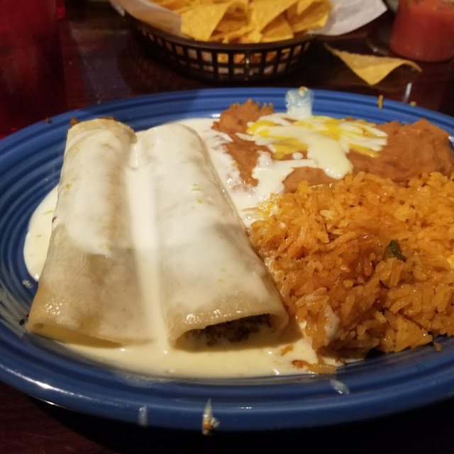 2 Beef Enchiladas Queso Sauce Beans and Rice and Beans