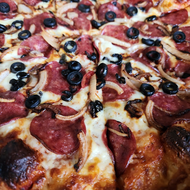 Pepperoni Olive and Red Onion Pizza