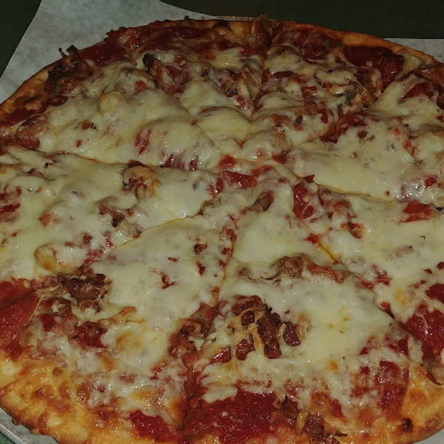 Larry's Special Pizza Mushrooms Pepperoni Sausage Onions and Sweet Peppers