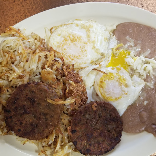 Two Eggs with Fajita with Refried Beans and Hasbrowns