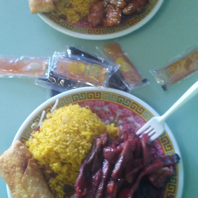 Boneless Ribs with Yellow Rice and a Egg Roll Combo
