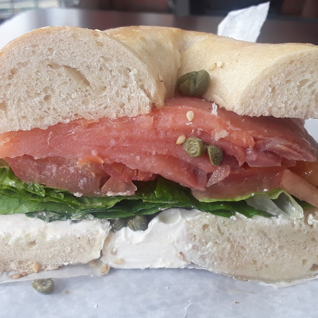 Sesame Bagel with Fresh Lox Cream Cheese Lettuce Tomato & Capers