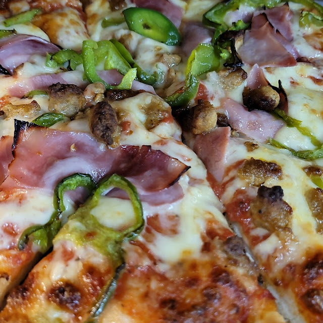 Sausage Ham Onion and Pepper Pizza