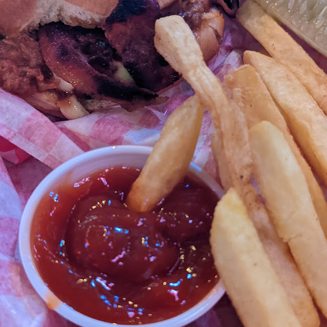 Slaw Hog Basket Fries and Pickle Spear