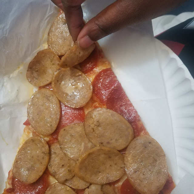 Pepperoni and Sausage Slice of Pizza