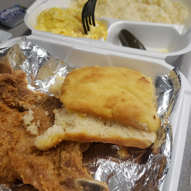Fried Pork Chop with 2 Eggs Grits and a Biscuit