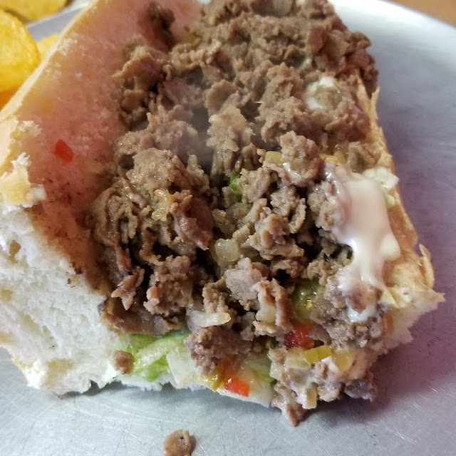 Half of a Cheesesteak with Everything