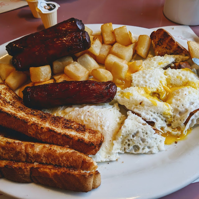 Eggs Sausages and Home Fries with Toast