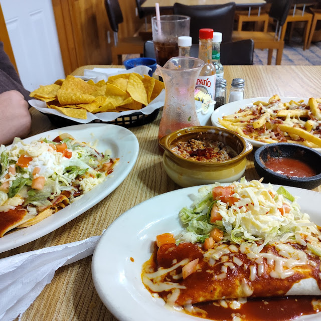 Salsa and Chips Enchiladas and Burrito Supreme and Queso Chorizo Dip and Queso Bacon Fries