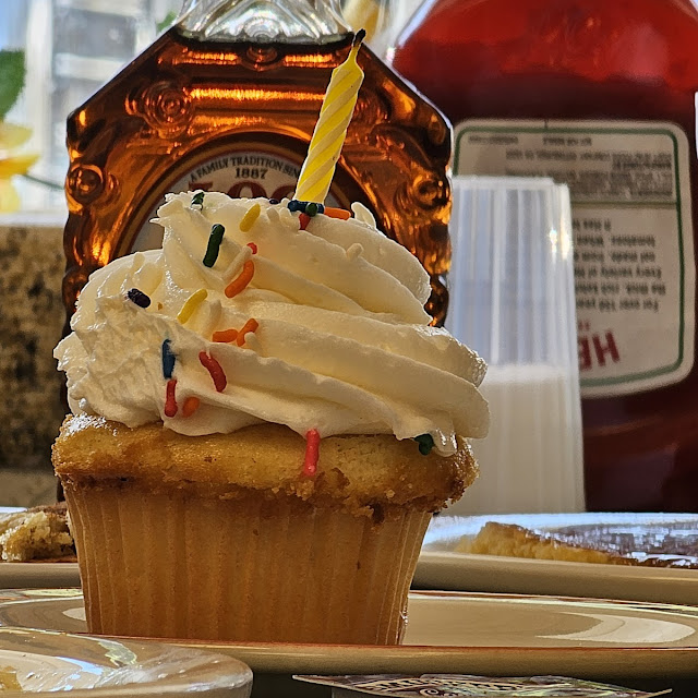 Birthday Cupcake Sampled by Recipient Before Sneaking a Pic