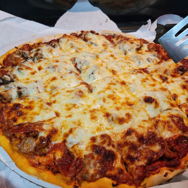 Thin Crust Mushroom and Sausage Pizza