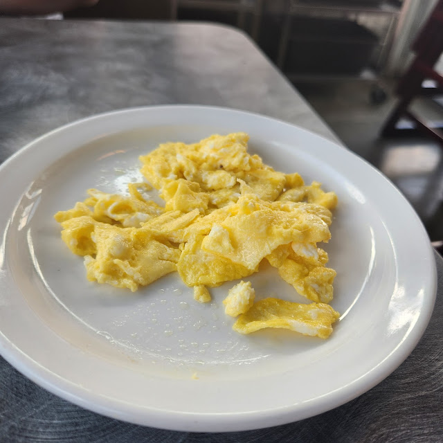 Two Scrambled Eggs with A
